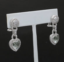 Load image into Gallery viewer, These sterling silver heart-shaped earrings will make your heart skip a beat. F
