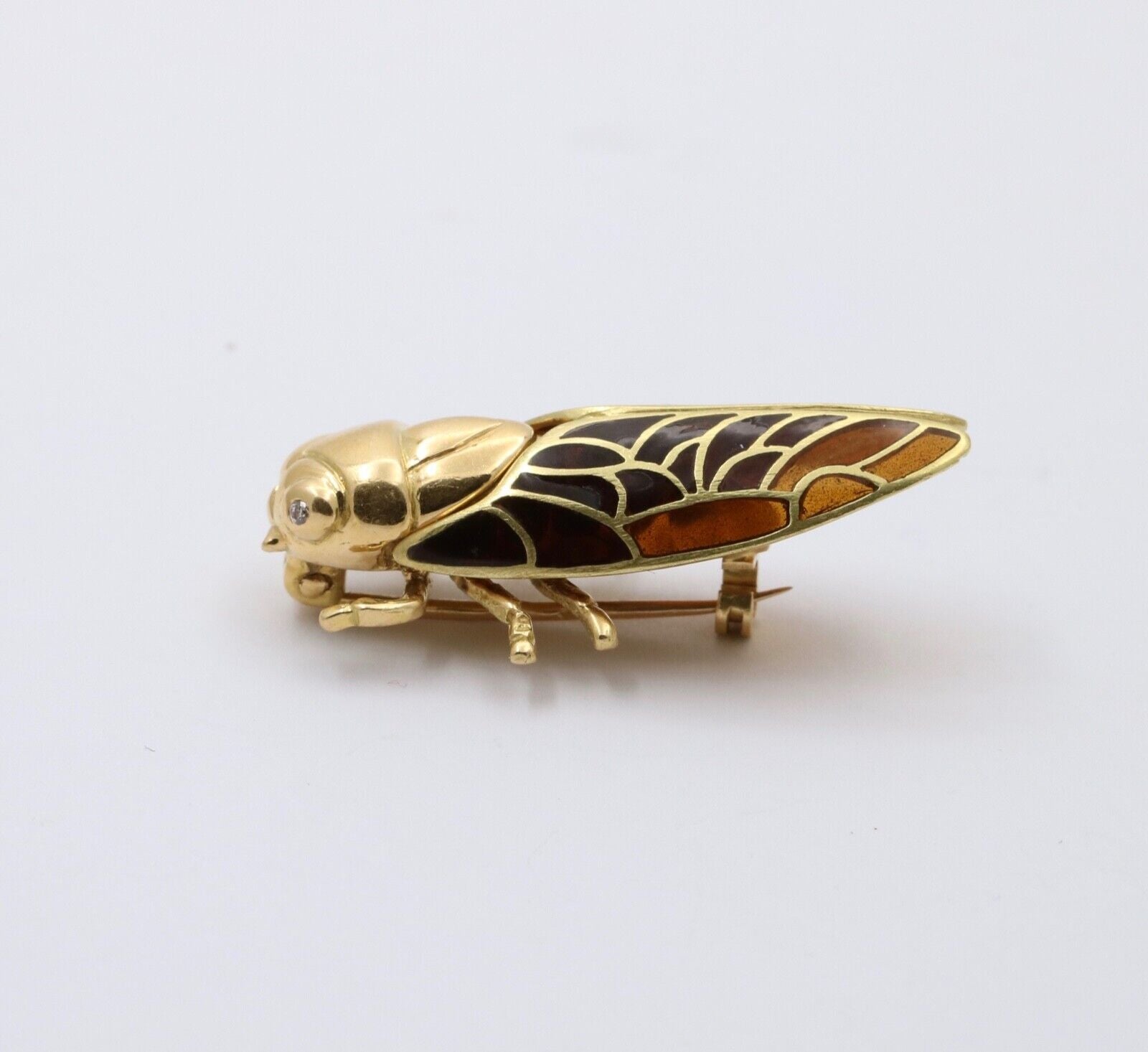 The Handcrafted 18K Yellow Gold Plique A Jour Cicada Diamond Brooch.