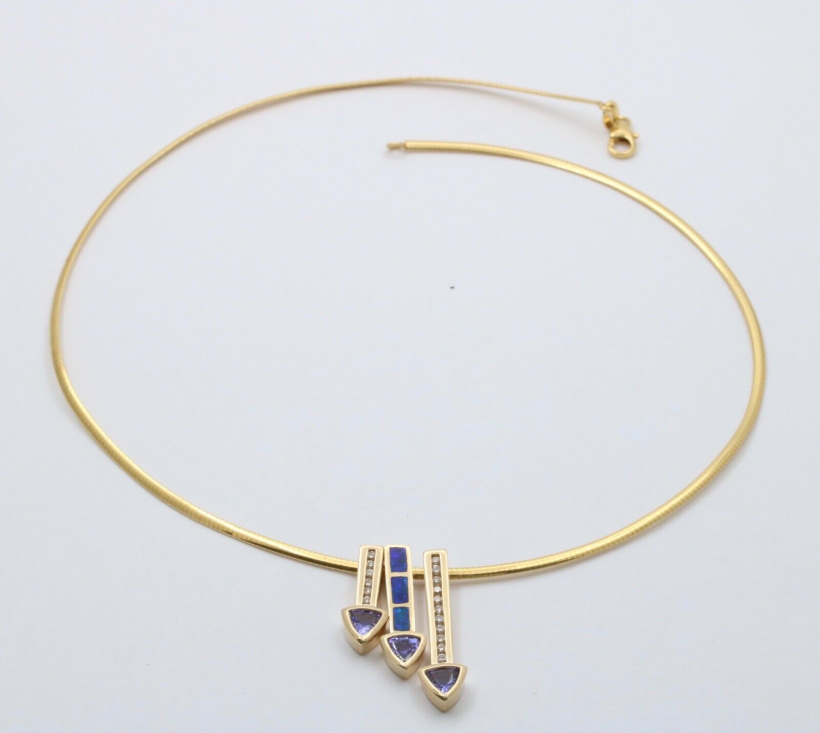 Striking 14K Gold Tanzanite, Opal and Diamond Three Arrows Pendant Necklace.