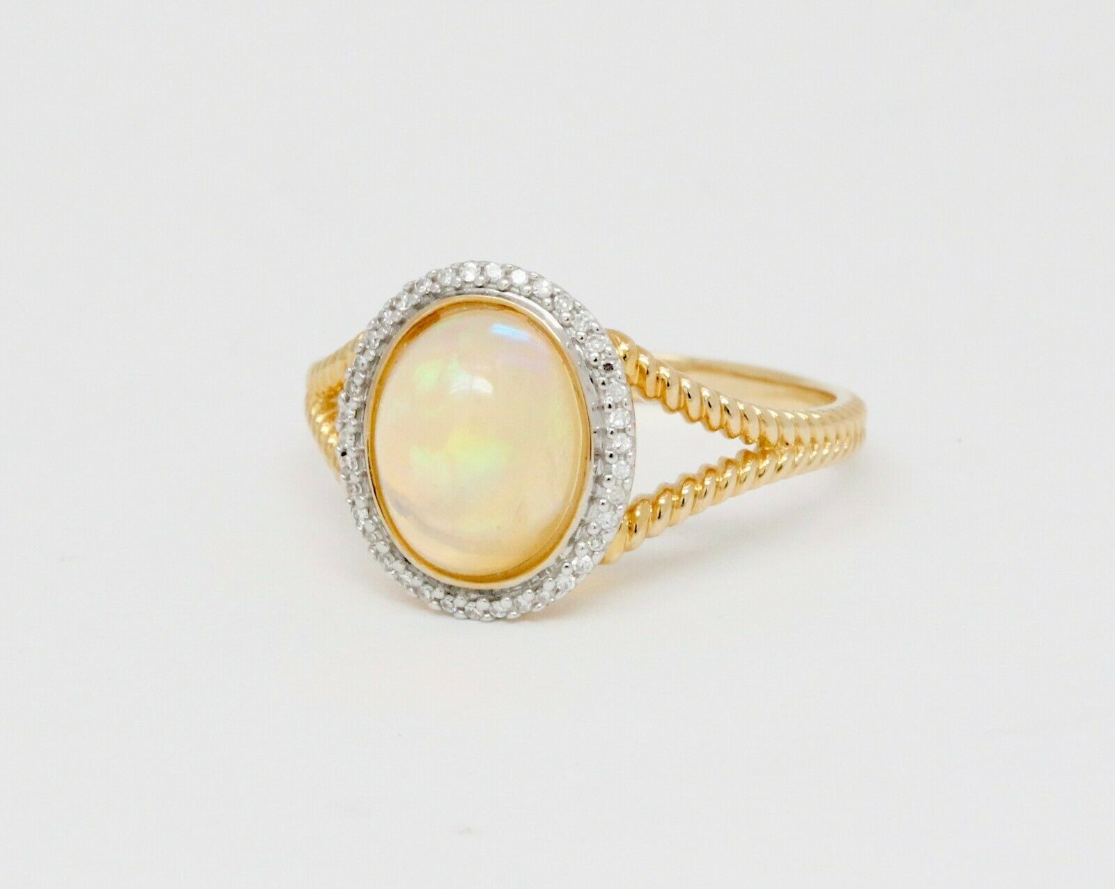 Vintage 14K Yellow Gold Opal and Diamond Halo Ring