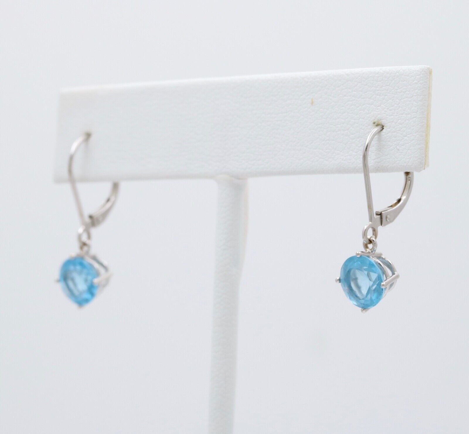 Lovely 18K White Gold Blue Topaz Dangle Earrings.