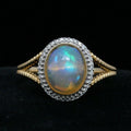 Vintage 14K Yellow Gold Opal and Diamond Halo Ring