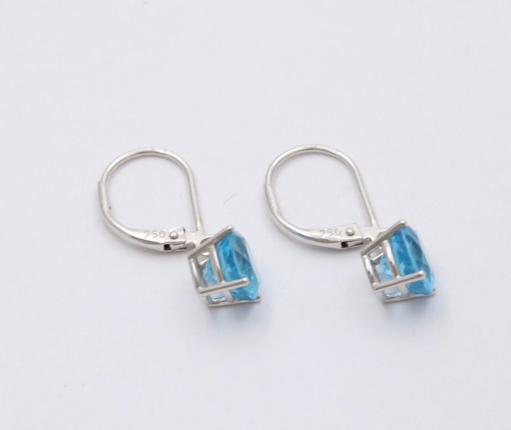 Lovely 18K White Gold Blue Topaz Dangle Earrings.