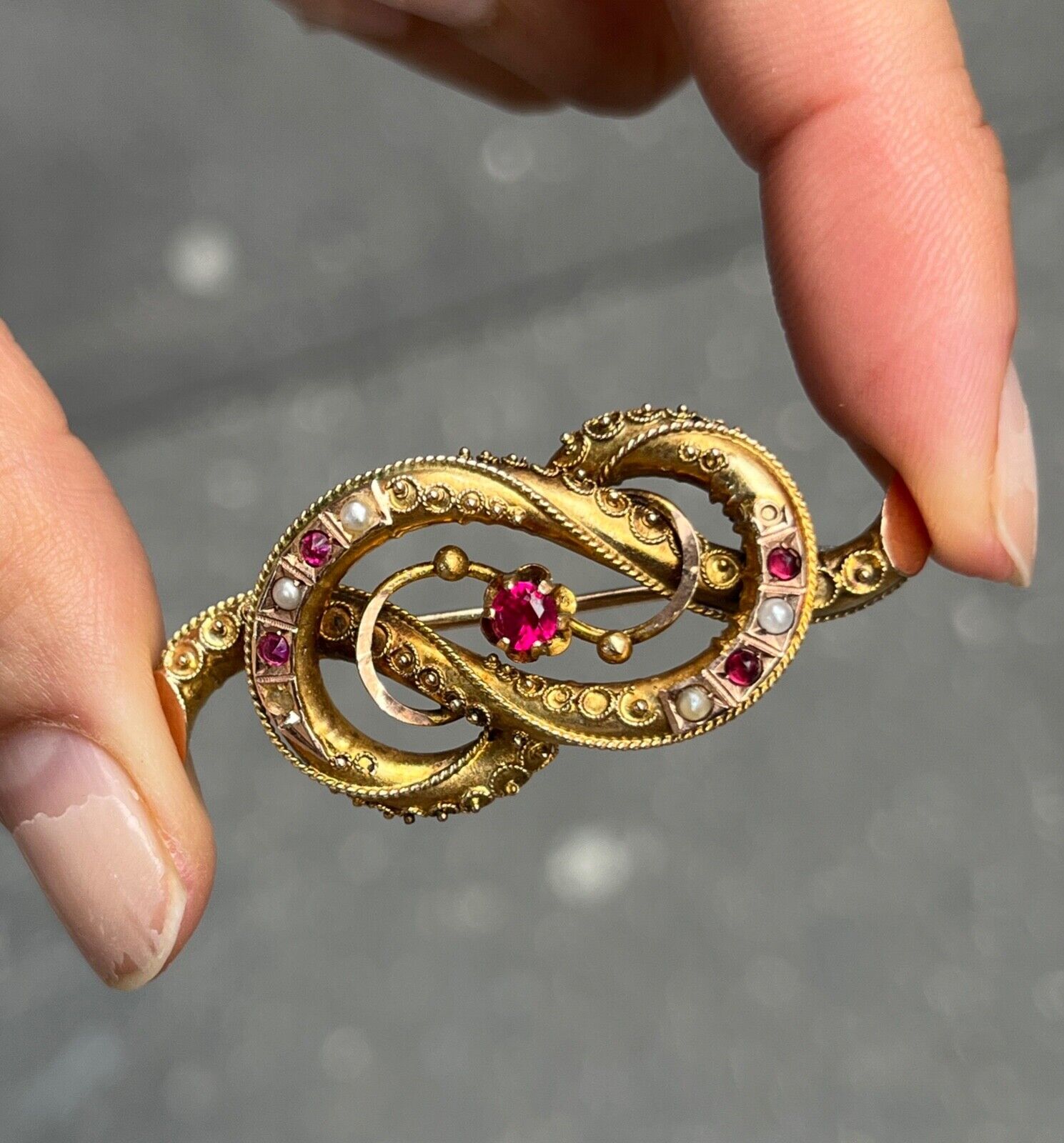Victorian 12K Yellow Gold Ruby And Split Pearl Infinity love Knot Brooch