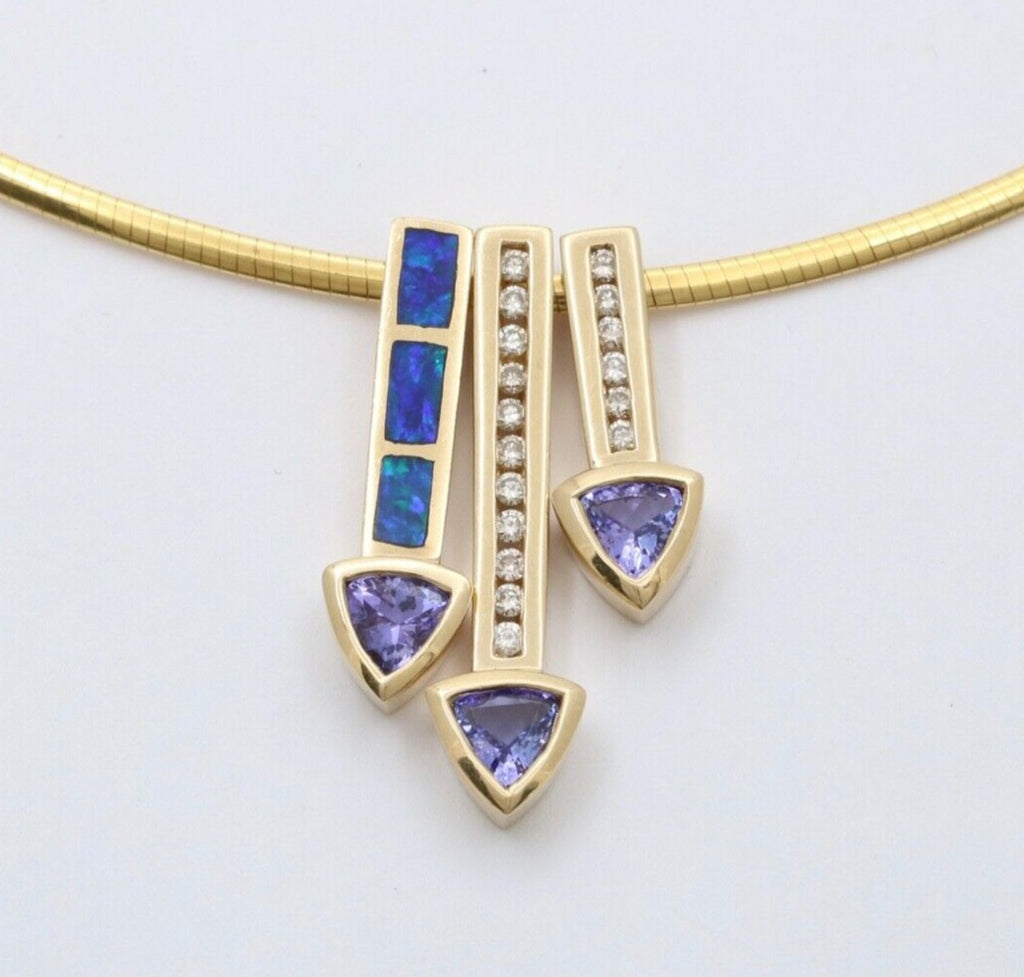 Striking 14K Gold Tanzanite, Opal and Diamond Three Arrows Pendant Necklace.