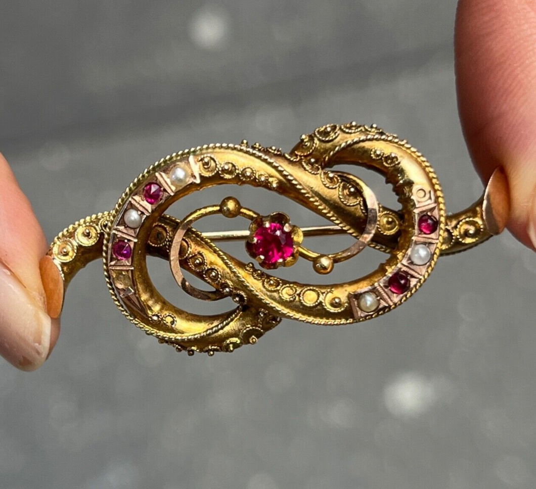 Victorian 12K Yellow Gold Ruby And Split Pearl Infinity love Knot Brooch