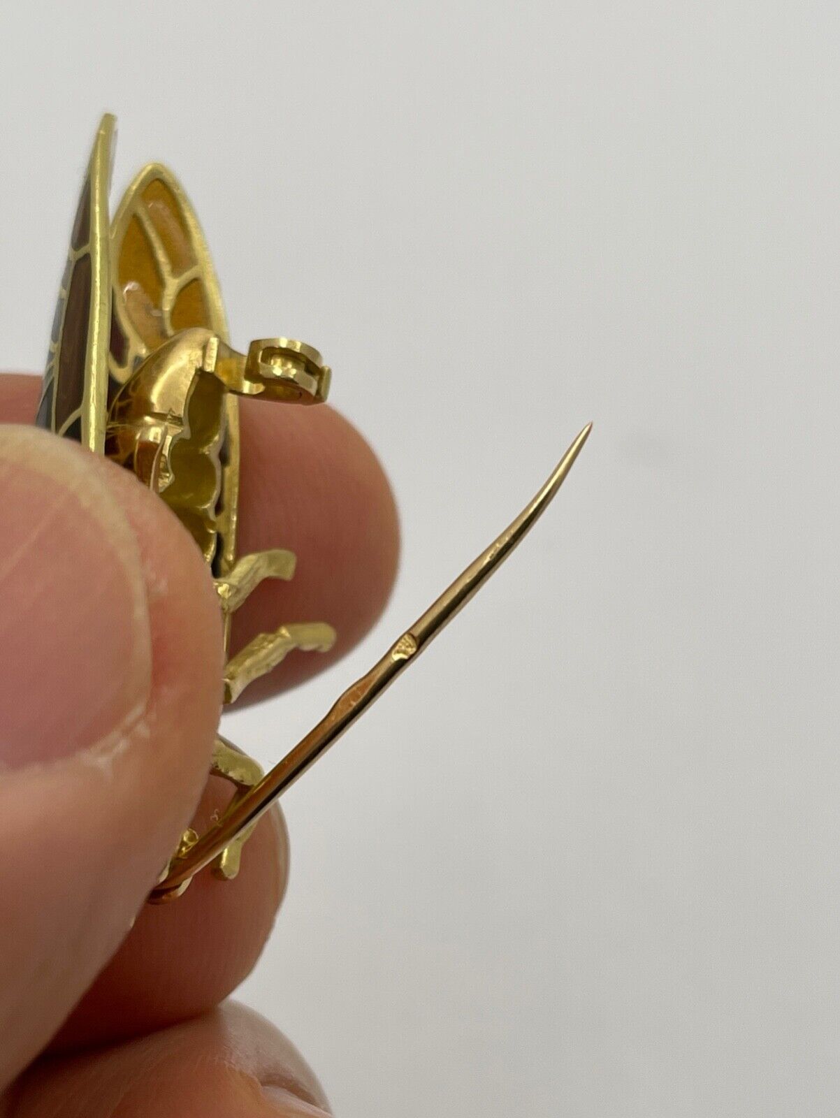 The Handcrafted 18K Yellow Gold Plique A Jour Cicada Diamond Brooch.