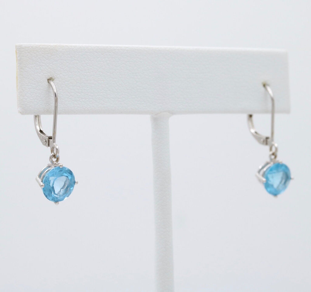 Lovely 18K White Gold Blue Topaz Dangle Earrings.