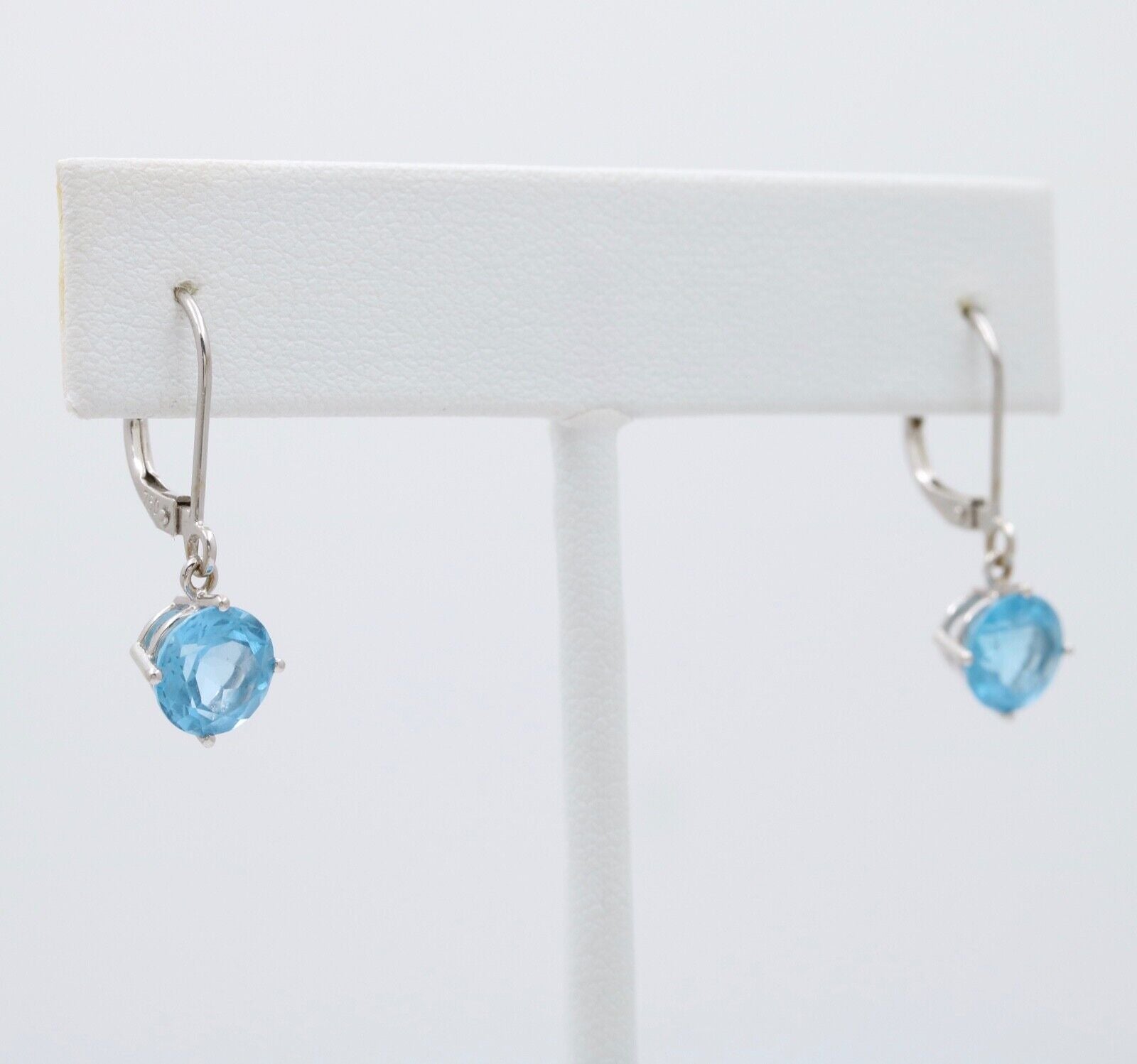 Lovely 18K White Gold Blue Topaz Dangle Earrings.
