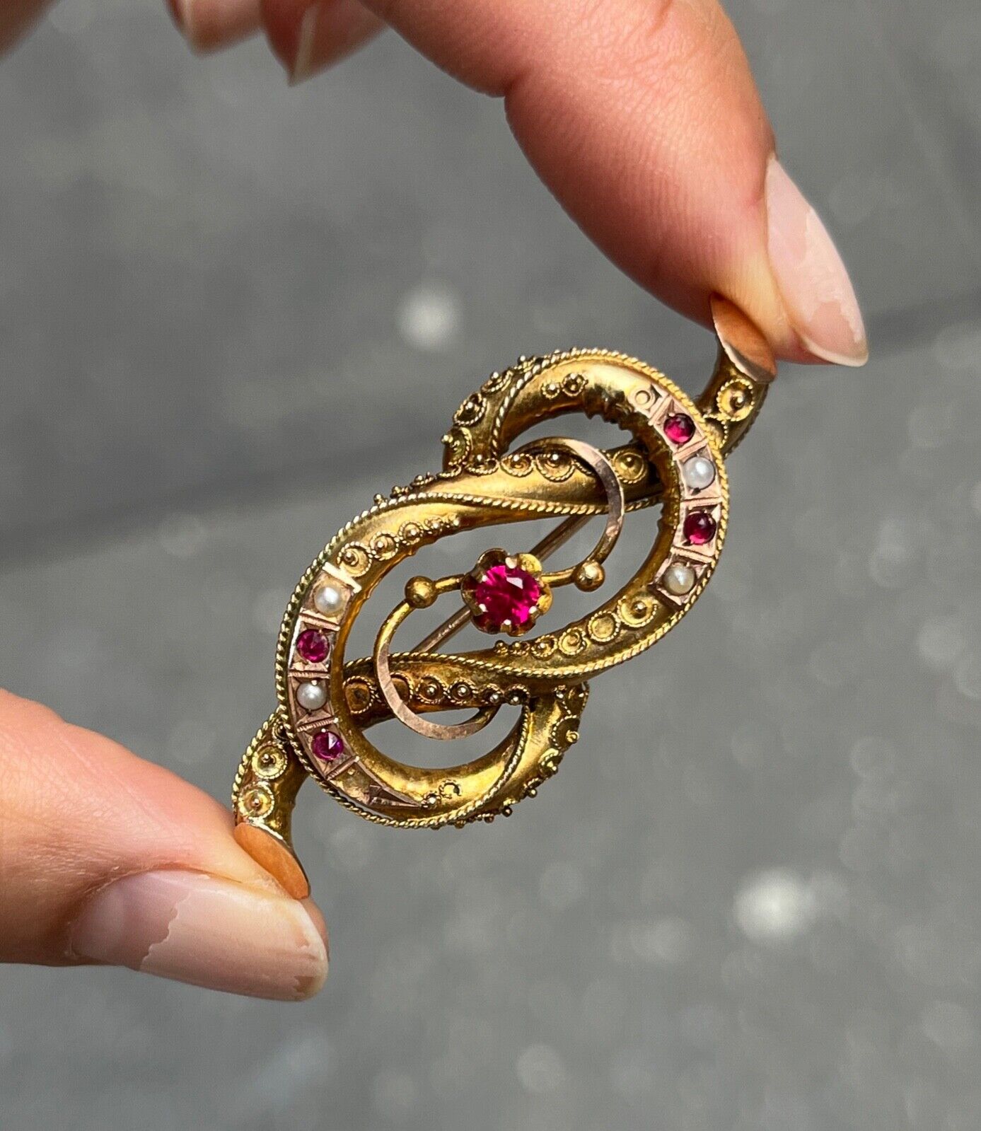 Victorian 12K Yellow Gold Ruby And Split Pearl Infinity love Knot Brooch