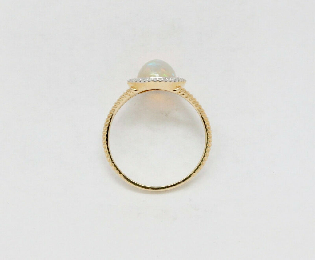 Vintage 14K Yellow Gold Opal and Diamond Halo Ring