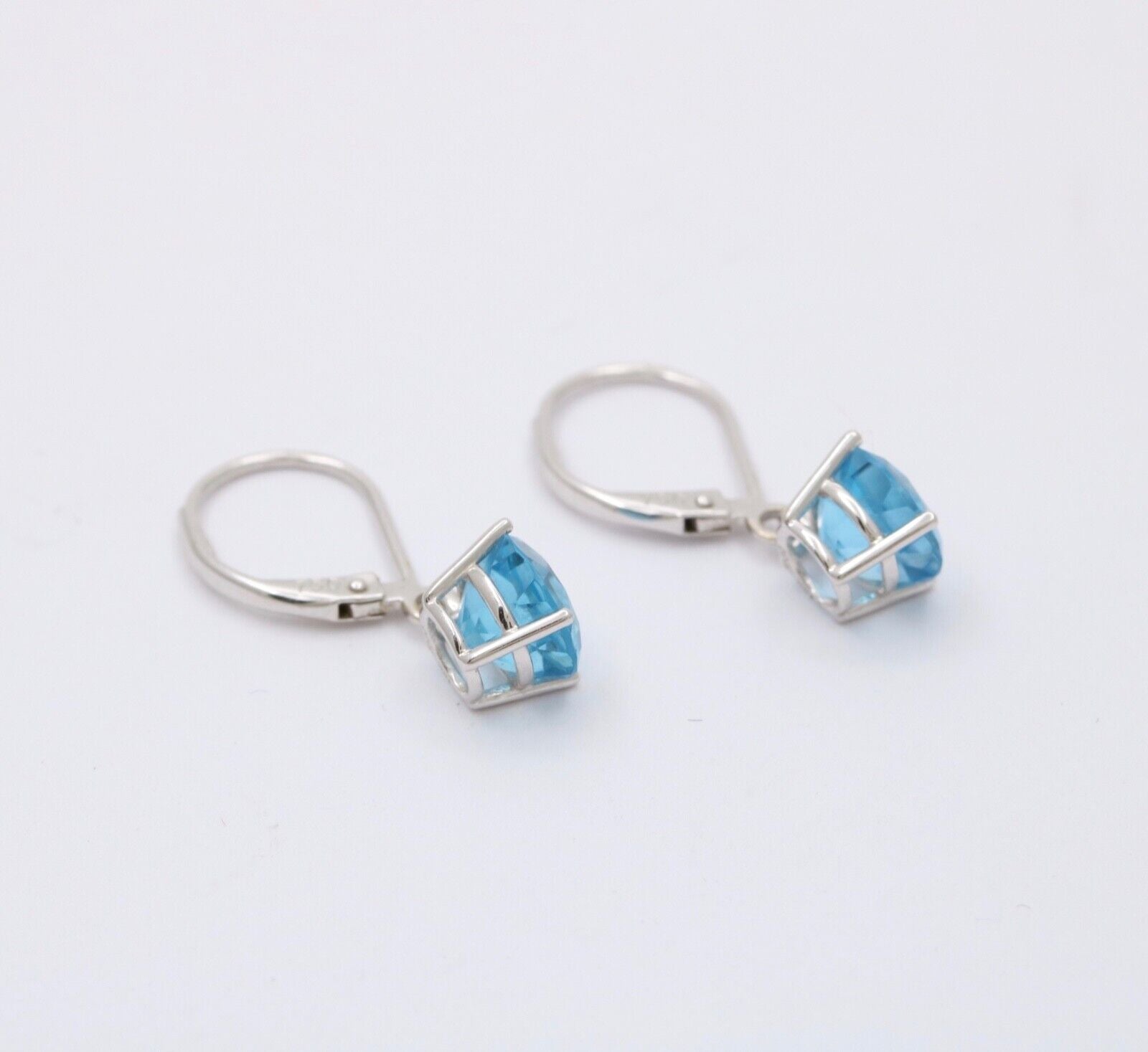 Lovely 18K White Gold Blue Topaz Dangle Earrings.