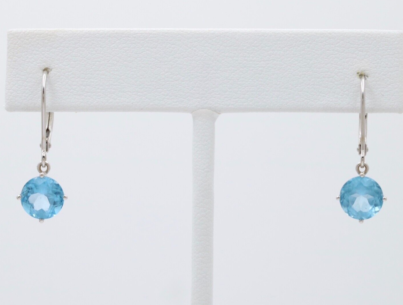Lovely 18K White Gold Blue Topaz Dangle Earrings.