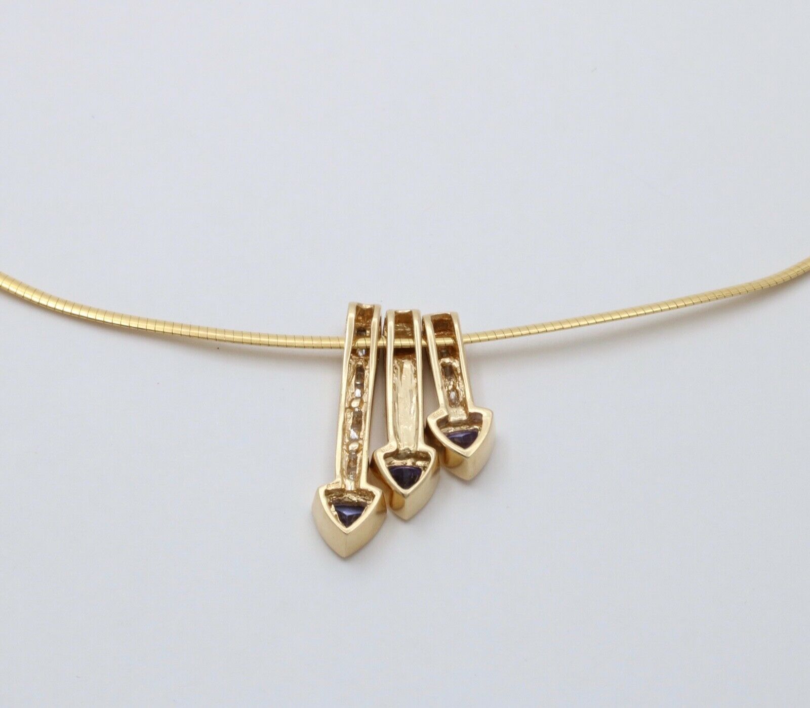 Striking 14K Gold Tanzanite, Opal and Diamond Three Arrows Pendant Necklace.
