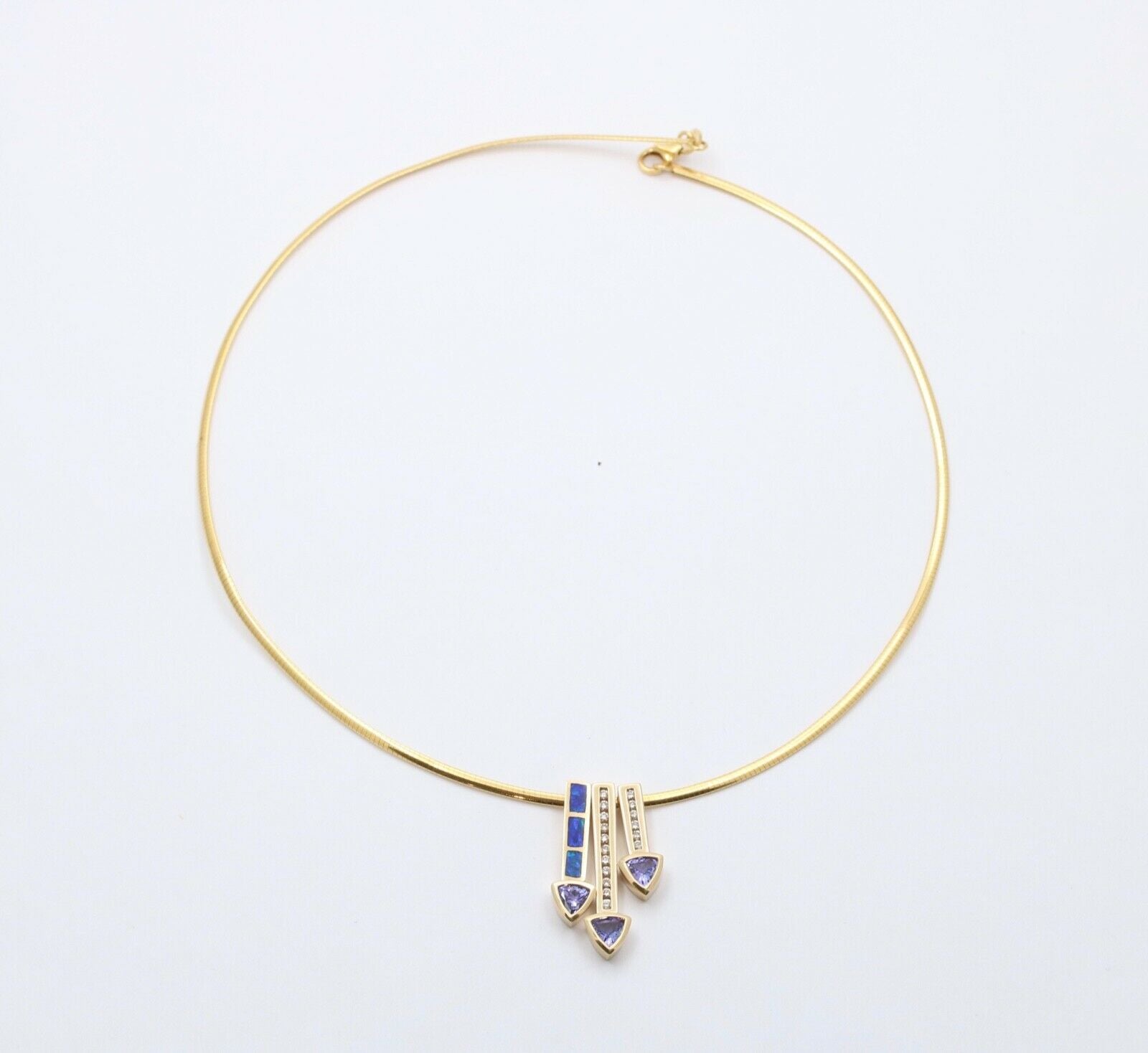 Striking 14K Gold Tanzanite, Opal and Diamond Three Arrows Pendant Necklace.
