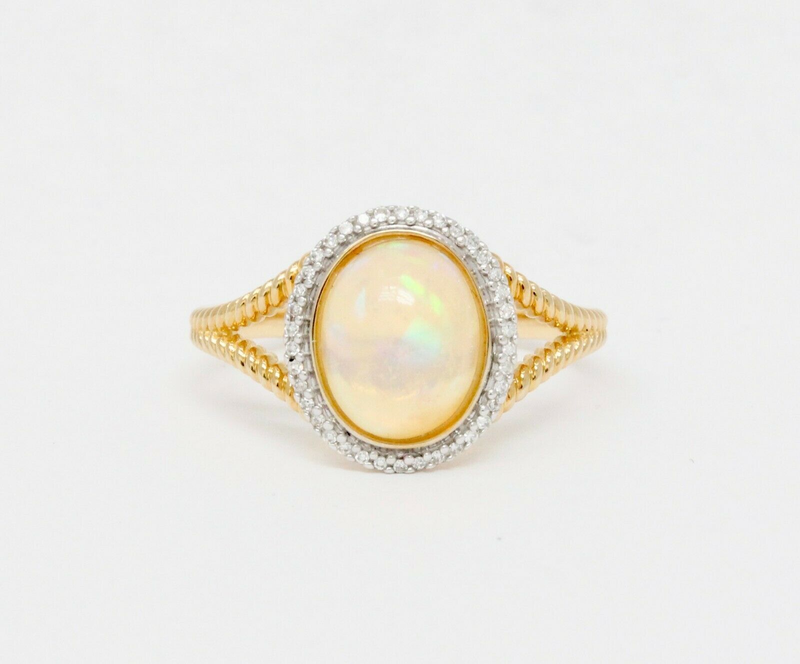 Vintage 14K Yellow Gold Opal and Diamond Halo Ring