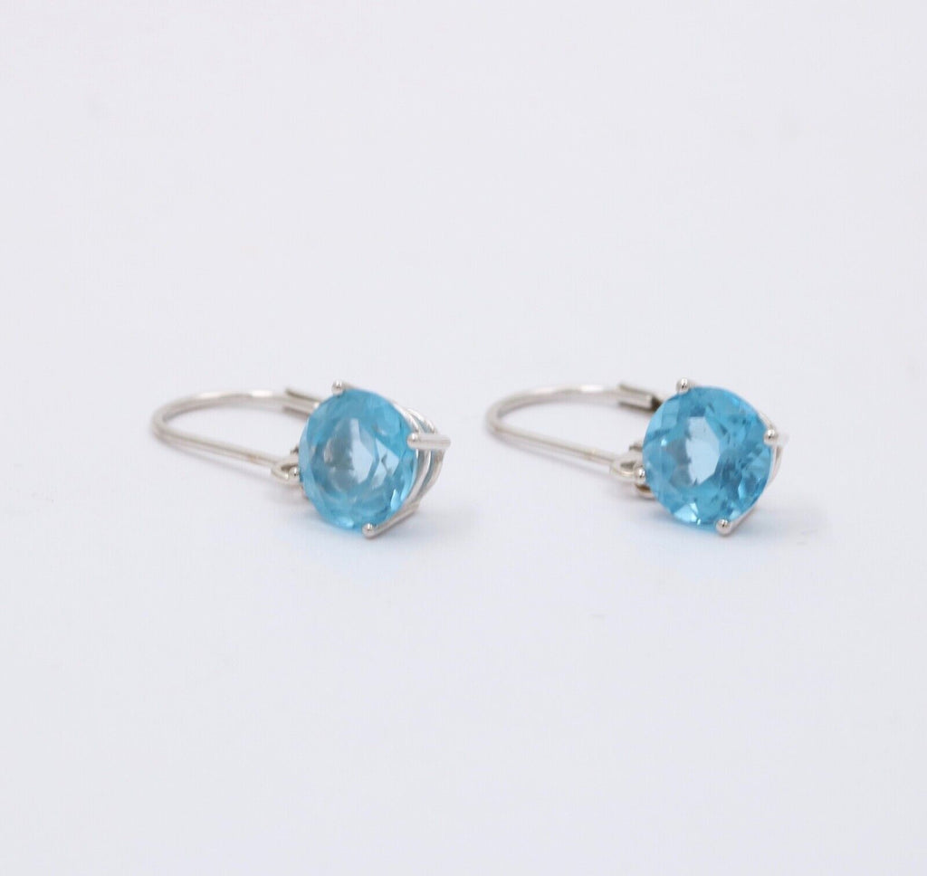 Lovely 18K White Gold Blue Topaz Dangle Earrings.