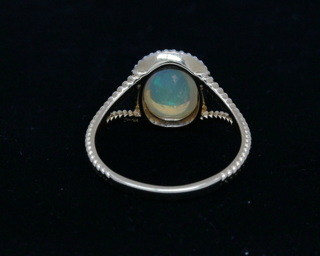 Vintage 14K Yellow Gold Opal and Diamond Halo Ring