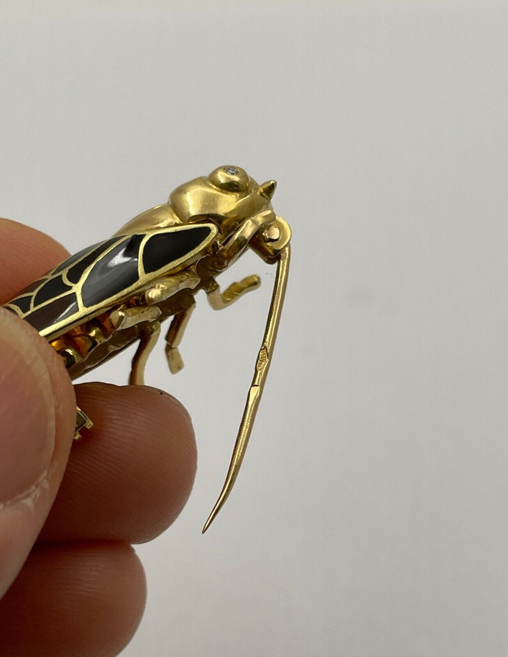 The Handcrafted 18K Yellow Gold Plique A Jour Cicada Diamond Brooch.