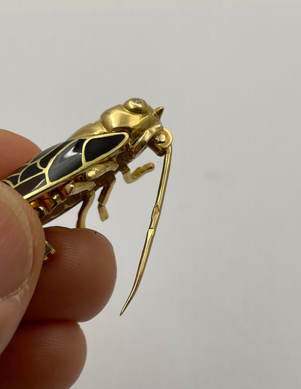The Handcrafted 18K Yellow Gold Plique A Jour Cicada Diamond Brooch.